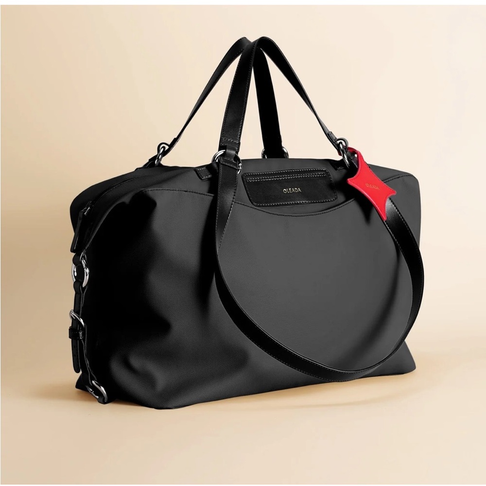 Oleada Anywhere any duffle bag 35 L color Tokyo black new w out tags